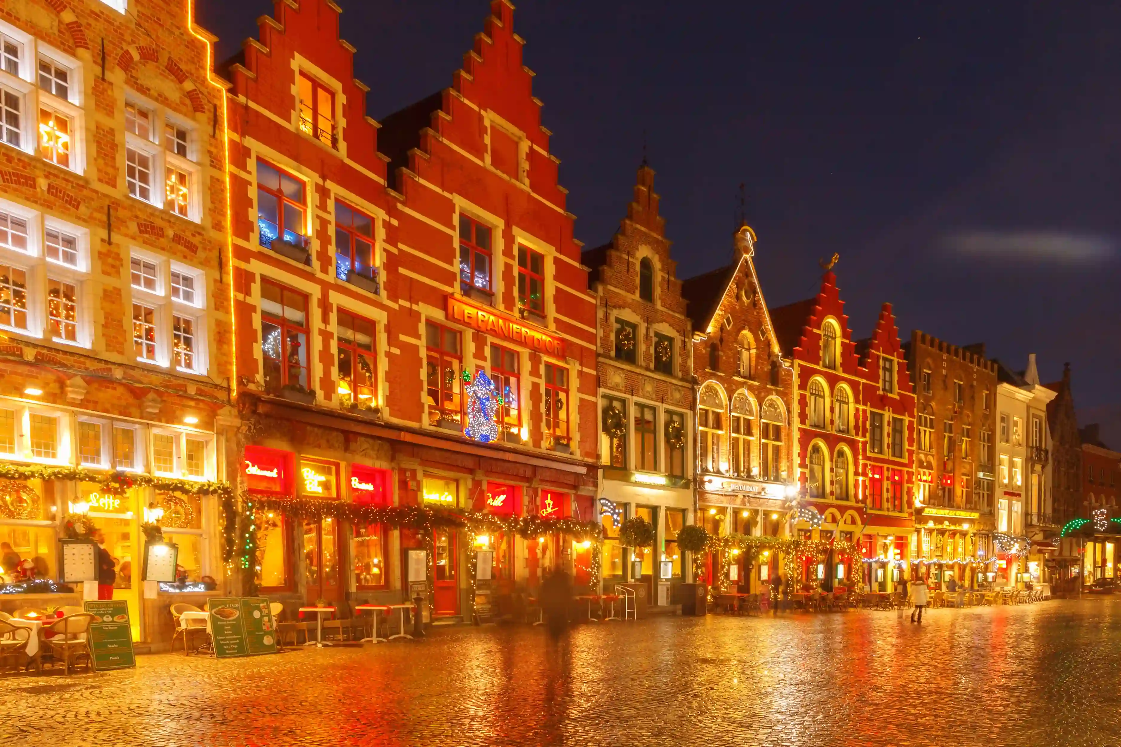 Bruges' Market Square decorated with Christmas lights.