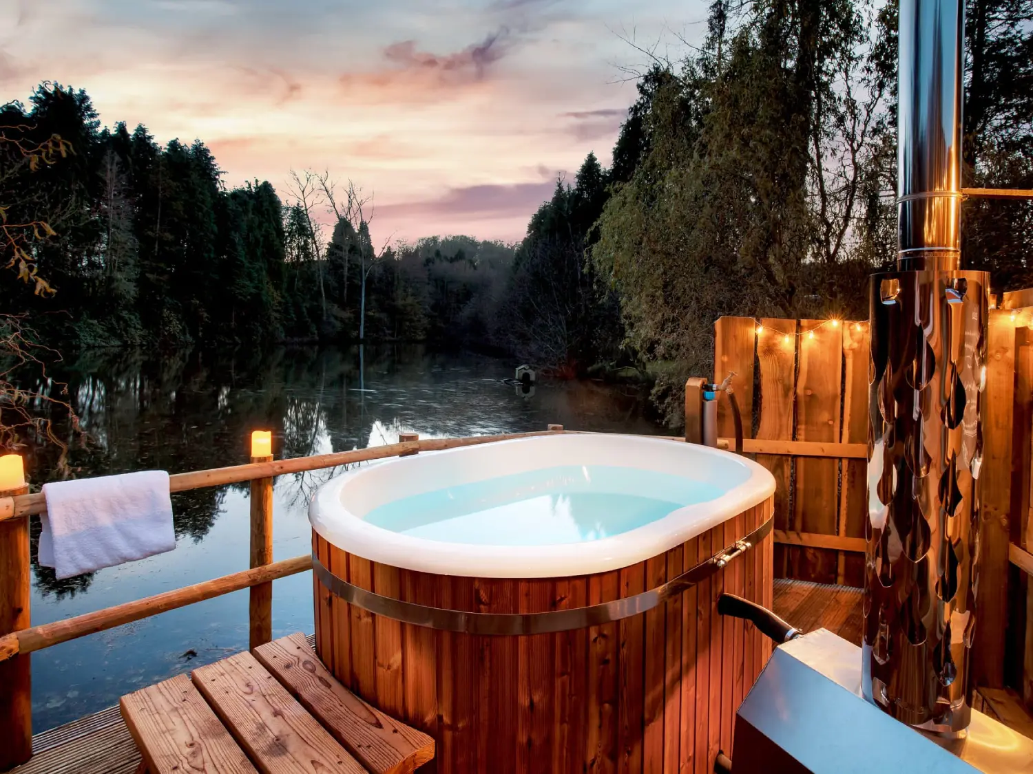 Hot tub overlooking the lake at Shepherd's Keep, The Shepherd's Hut Retreat.