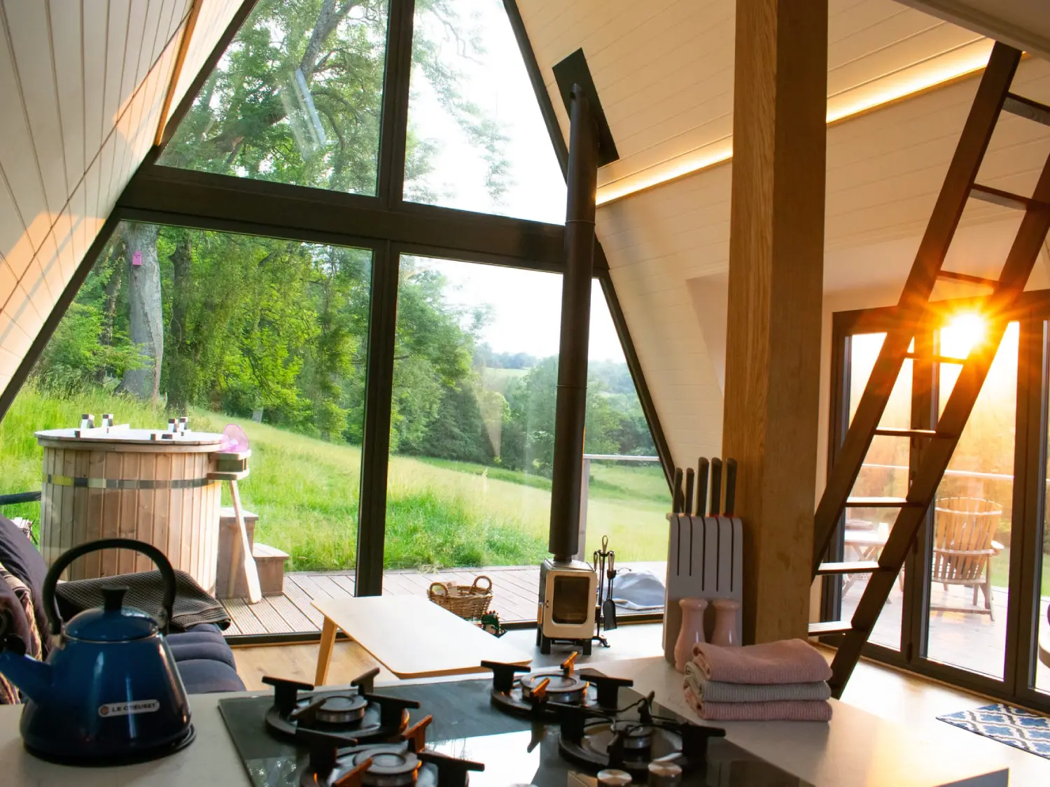 The living room area with hot tub on decking of The A Frame lodge, The Fold.