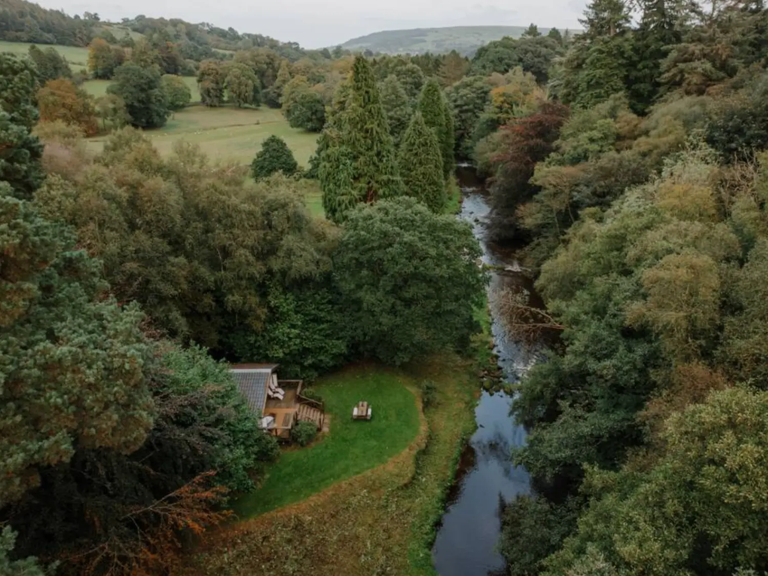 Aerial shot of the river lodge with the River Esk running past.