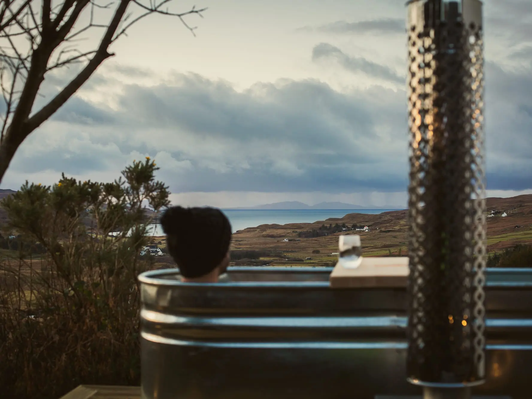 Outdoor soaking tub overlooking the surrounding scenery at the West Nest