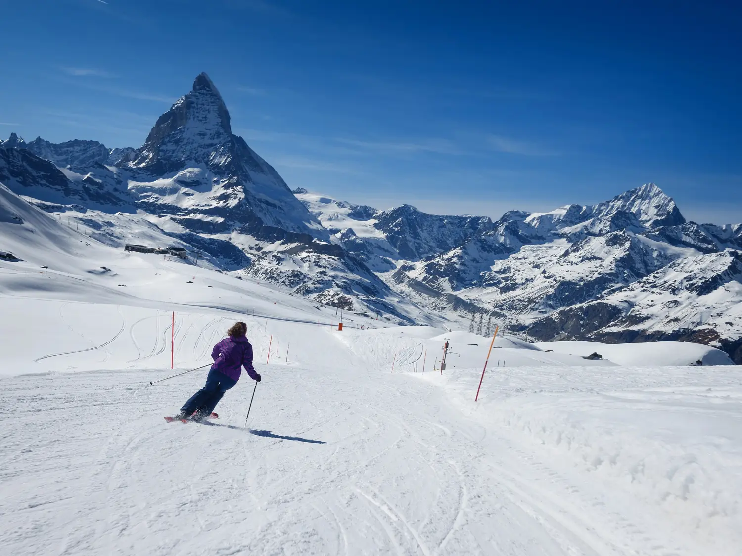 Female skiing down the slopes of the Matterhorn Mountain, Zermatt, Switzerland.