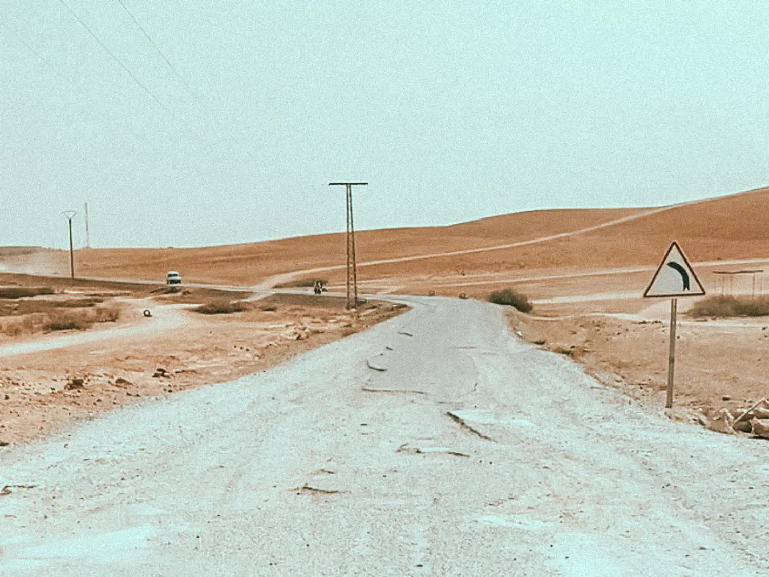 Gravel road filled with potholes on way to our accommodation in Agafay Desert