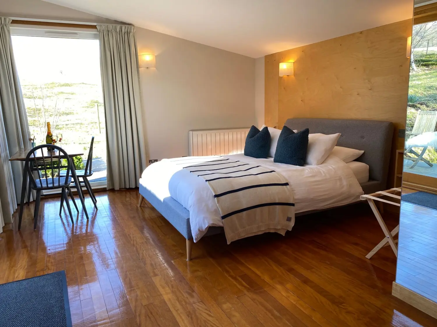 Darroch Garden Room Interior with double bed and dining table. 