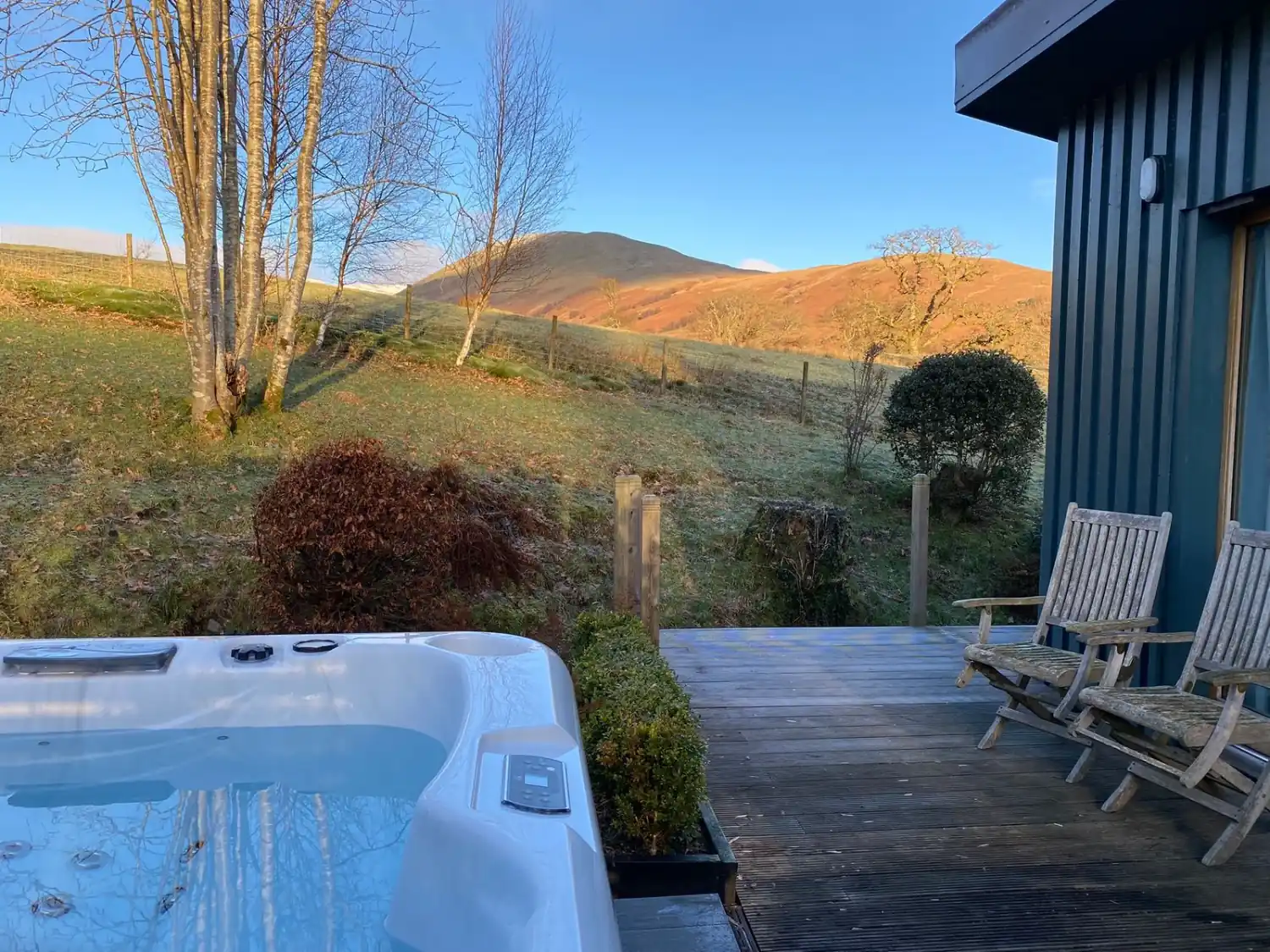 Darroch Garden Room Exterior with hot tub and decking overlooking hills.