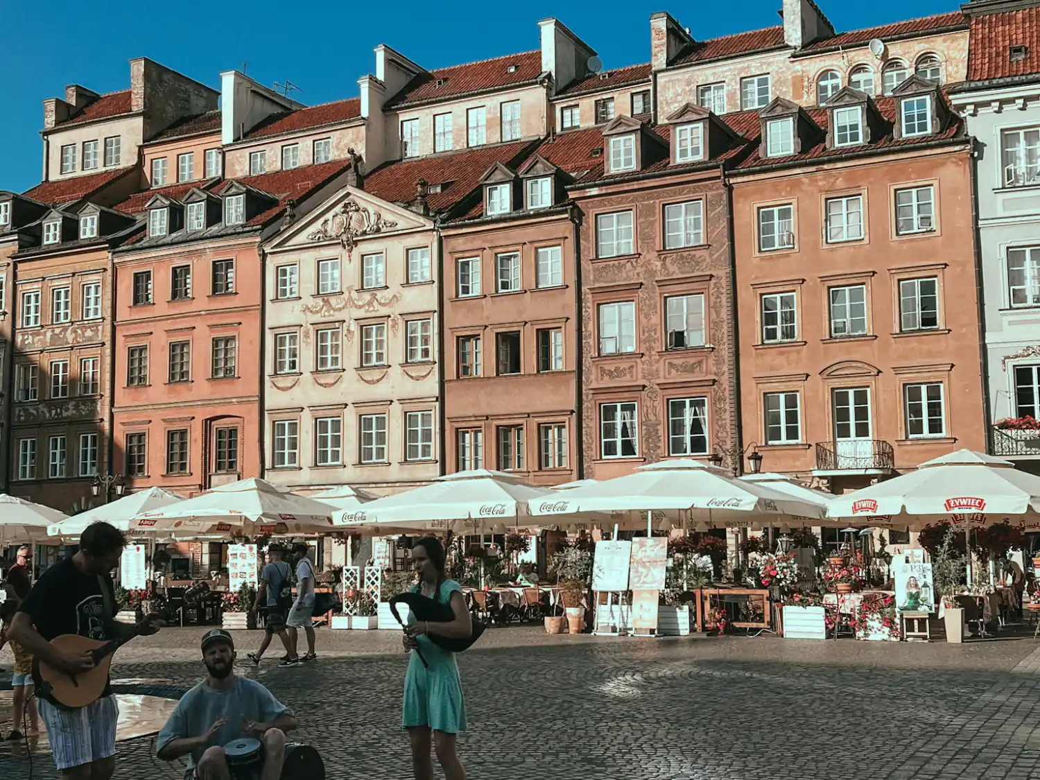 Buskers in the old town market square of warsaw, poland.