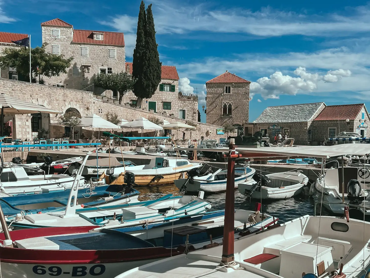 Bol in Brač Croatia with fishing boats and stone buildings.