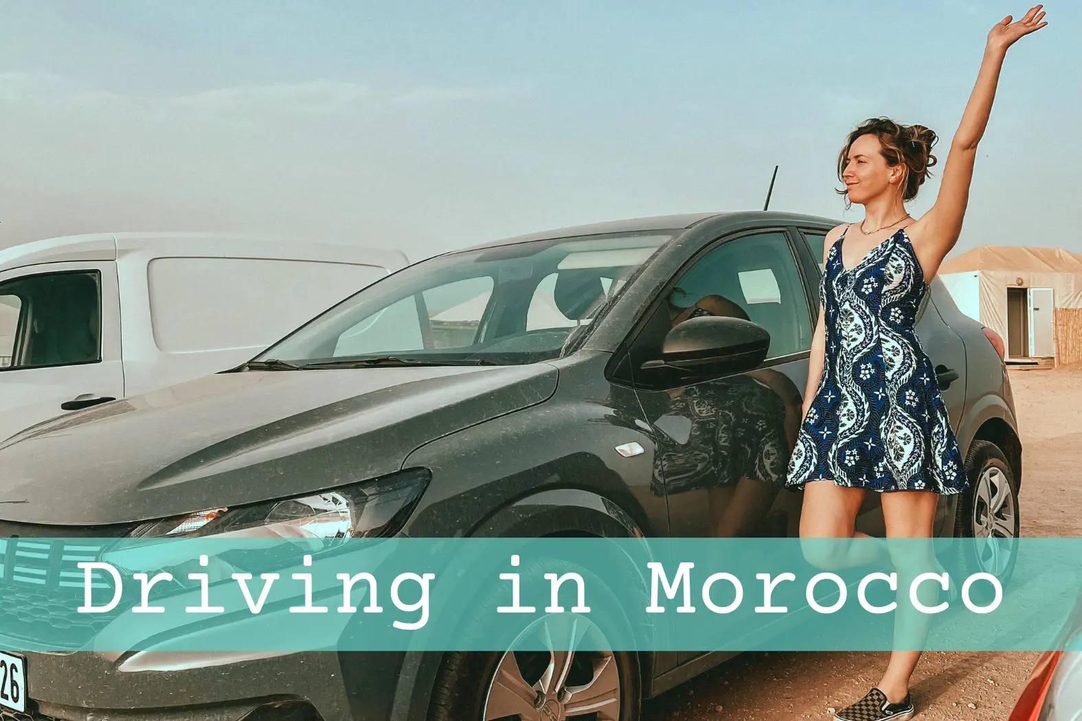 Girl standing next to rental car in Agafay Desert in Morocco