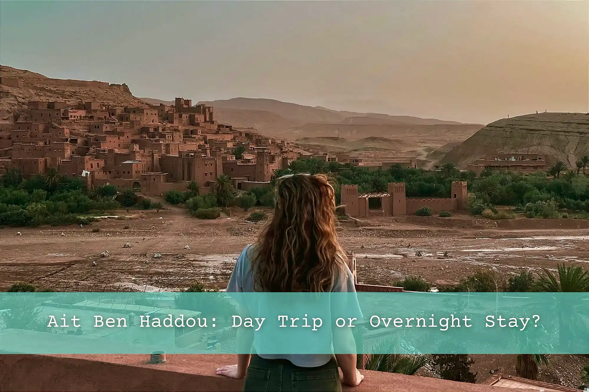 Girl looking at the sunrise over Ait Ben Haddou.