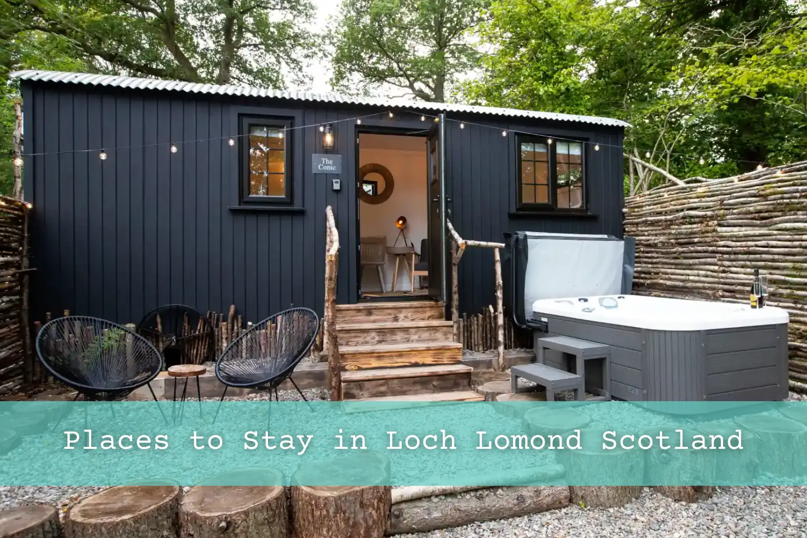 The Conic Hut with hot tub and decking chairs in front. 